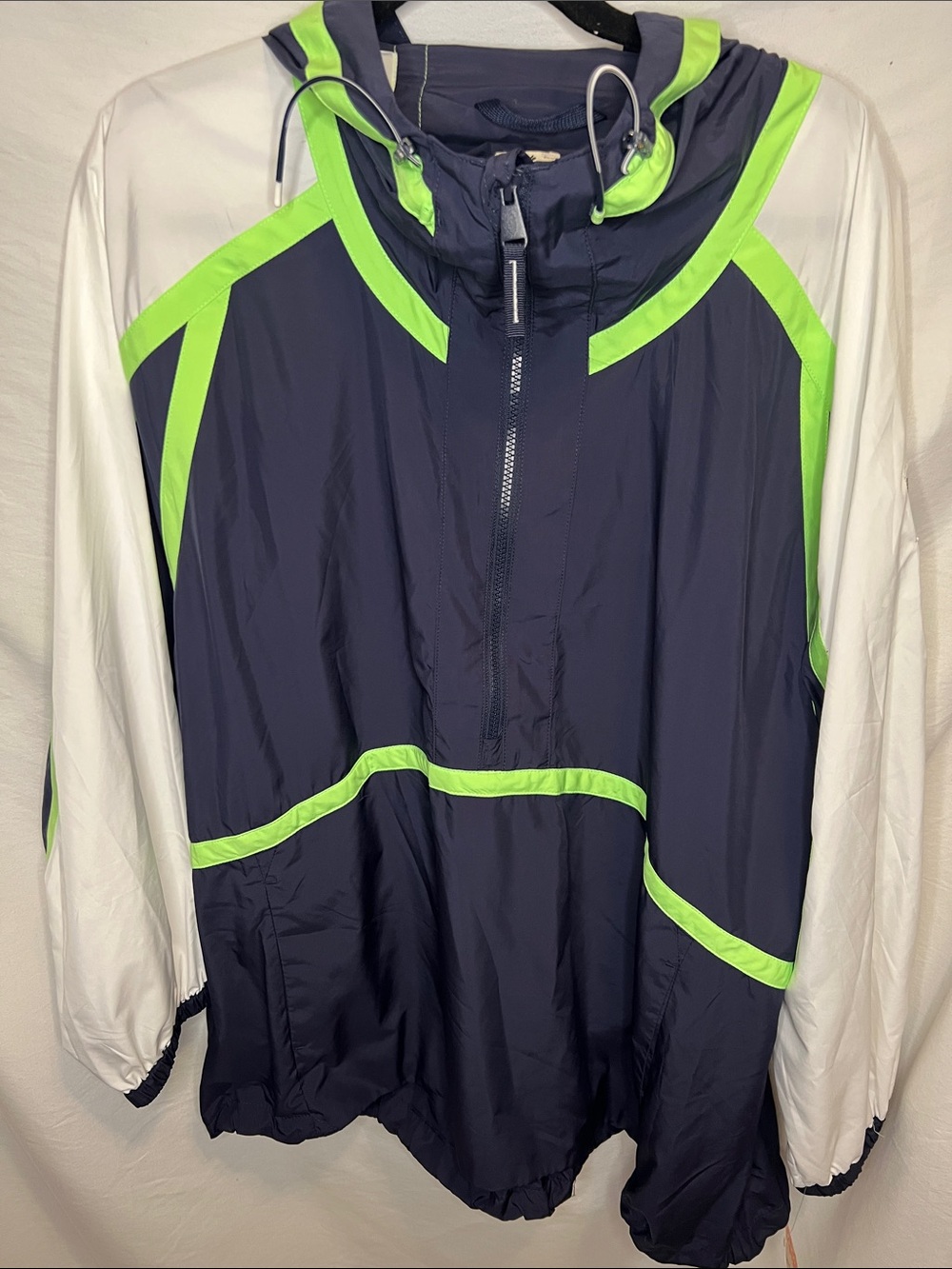 FP Movement Cares By The Wind block Logo in Navy and Lime Green Jacket. - Picture 5 of 13